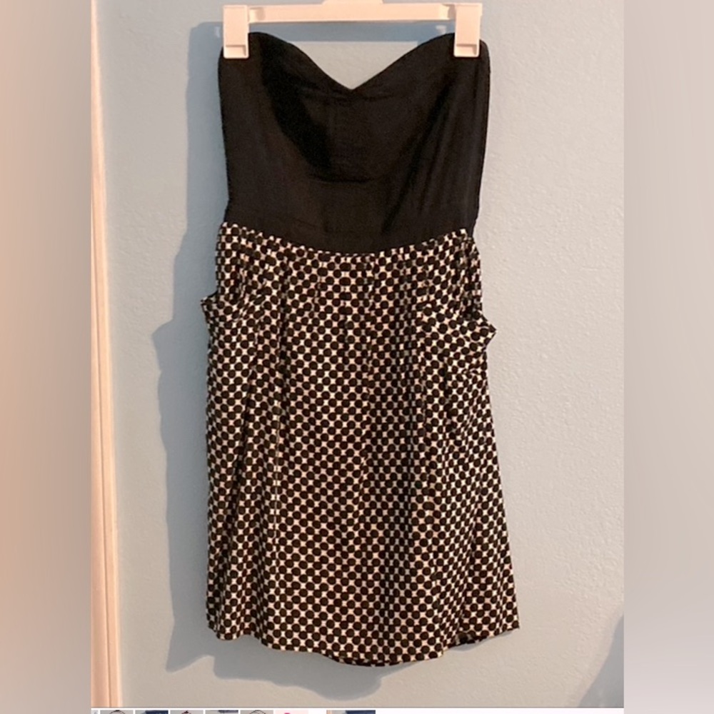 Exhilaration it’s black and checkered bottom dress with two pockets.